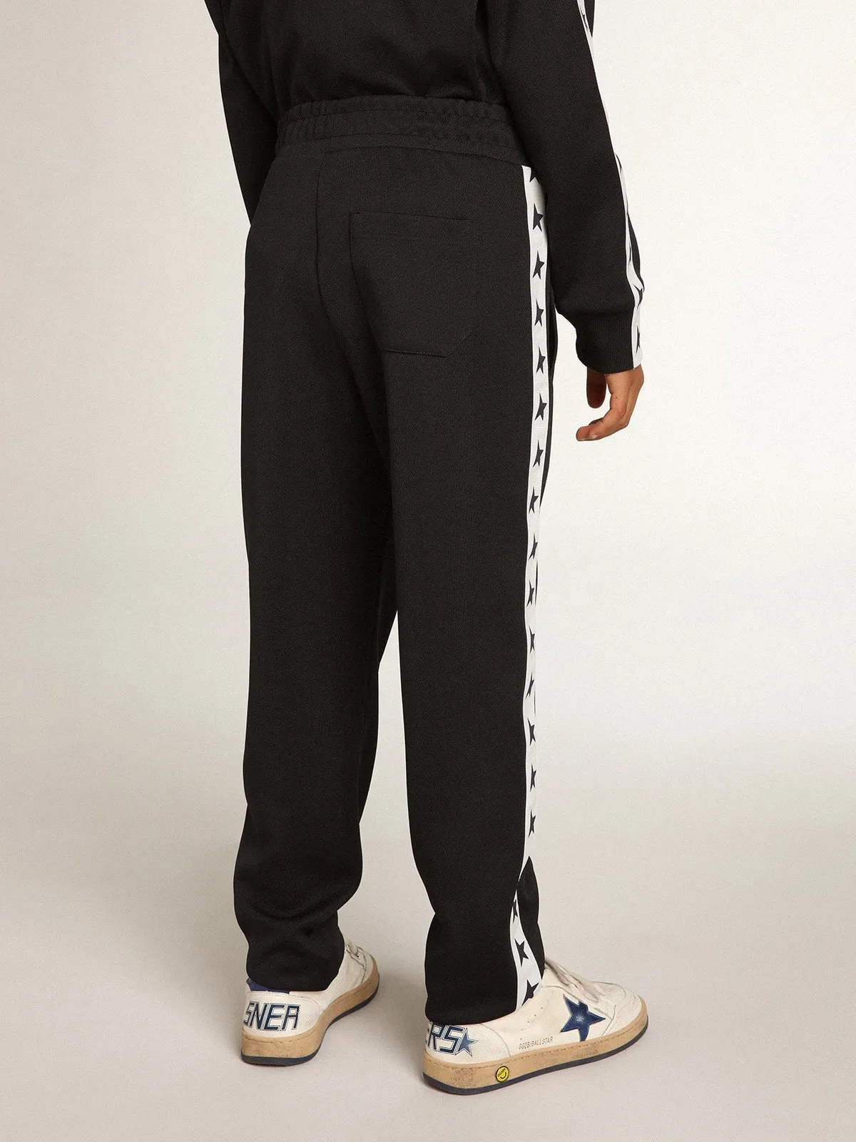 Dark blue joggers with white strip and contrasting stars