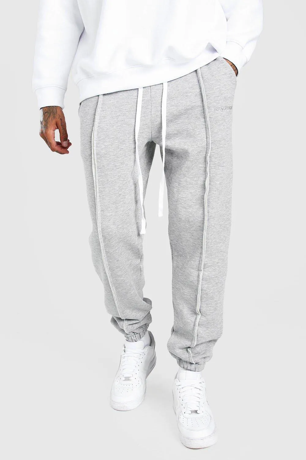 MAN Official Loose Fit Raw Seam Joggers