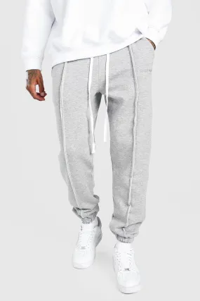 MAN Official Loose Fit Raw Seam Joggers